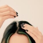 woman apply diy essential oil hair growth serum to scalp
