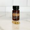 image of doTERRA MetaPWR Assist bottle and capsules on a kitchen counter