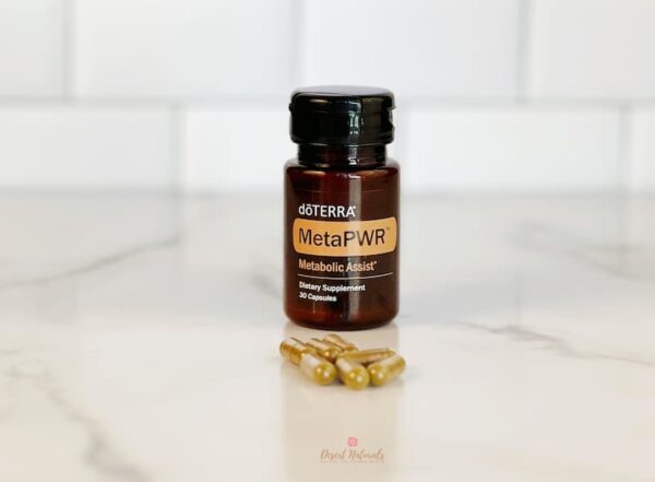 image of doTERRA MetaPWR Assist bottle and capsules on a kitchen counter