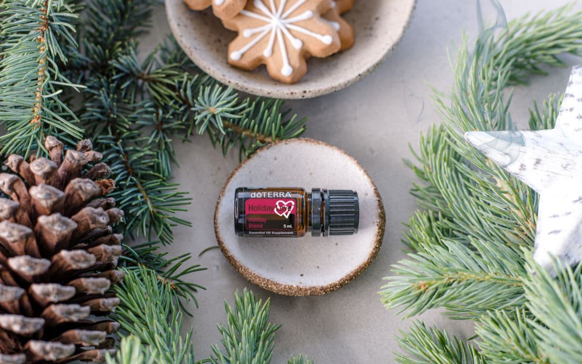 Christmas greenery and a bottle of doTERRA essential oil for diffuser blends