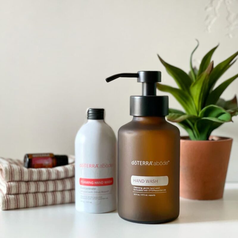 abode Foaming Hand Soap sq image of doterra abode hand soap concentrate with citrus bloom essential oil and glass dispenser with plant