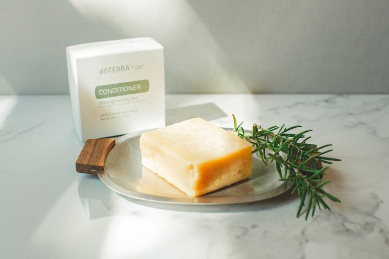 photo of doTERRA Conditioner Bar with a sprig of rosemary