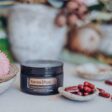 doterra yarrow pom capsules in a small bowl with flowers in the background