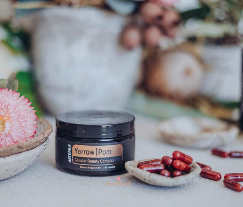 doterra yarrow pom capsules flowers doterra yarrow pom capsules in a small bowl with flowers in the background