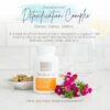 photo of bottle of doTERRA Zendocrine detox complex with capsules in a bowl and flower accents