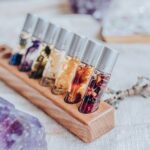 wood essential oil storage with rollers in it and amethyst stone