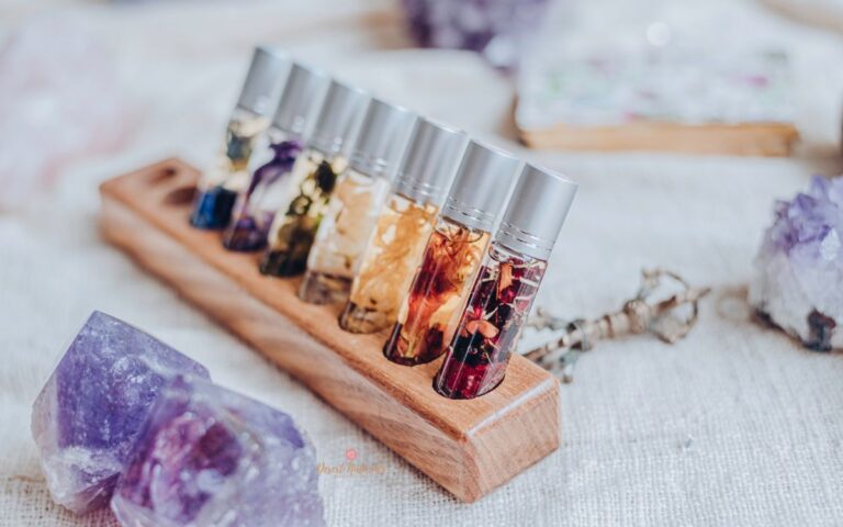 wood essential oil storage with rollers in it and amethyst stone