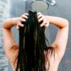 woman in shower applying diy hair mask