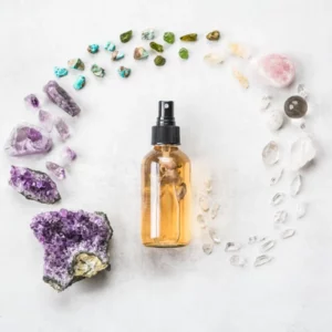 spray bottle for diy essential oil face toner with pretty crystals around it