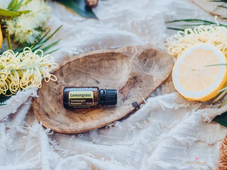 bottle of doterra lemongrass essential oil in a wood bowl