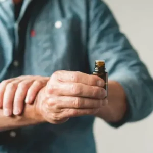 man apply essential oils