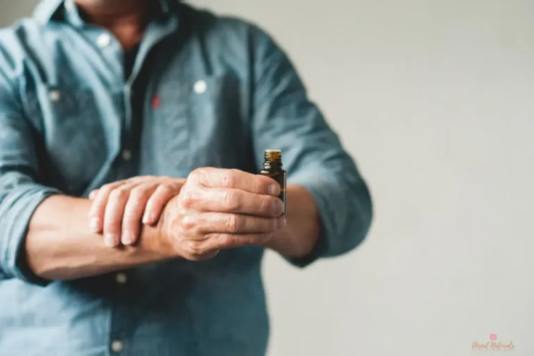 man apply essential oils