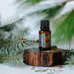 bottle of doterra siberian fir essential oil with tree sprigs