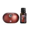 image of doterra ruby bubble diffuser with holiday joy essential oil on a white background