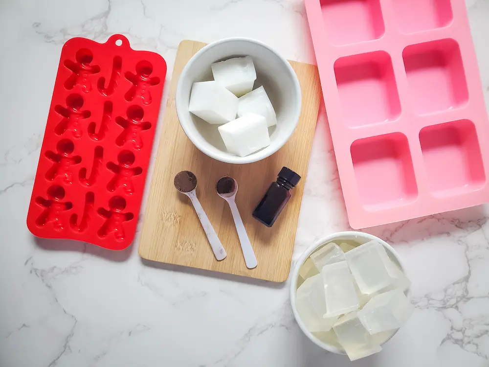 the supplies and ingredients for making gingerbread man soap