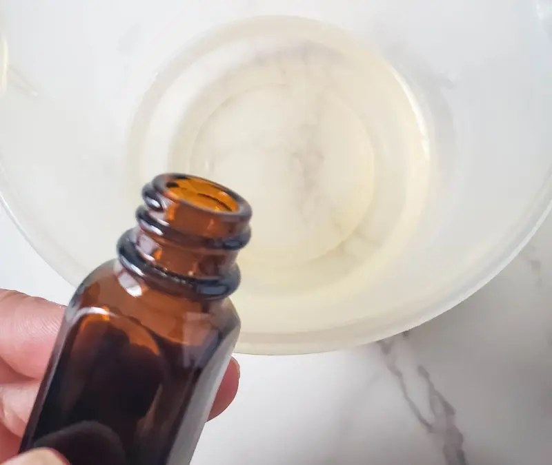 image of adding essential oil to melt and pour soap base