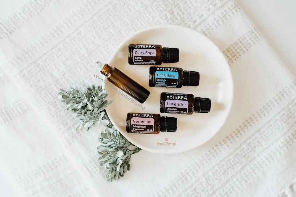 photo of essential oils and an empty roller to make a hormone balance blend