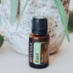 bottle of doterra basil essential oil with pretty green background