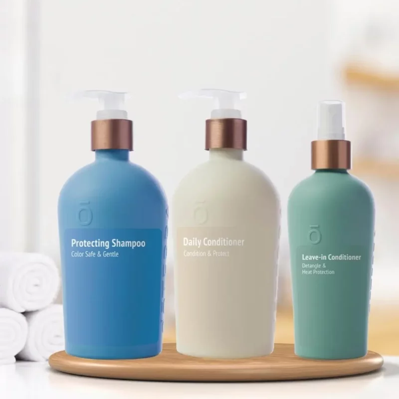 doterra hair care image of the doterra shampoo, daily conditioner, and leave in conditioner spray