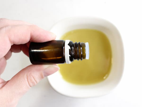 adding essential oils to cooled lymph drainage cream 