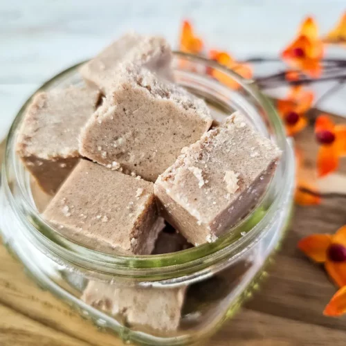 image of homemade pumpkin pie sugar scrub cubes in a glass jar
