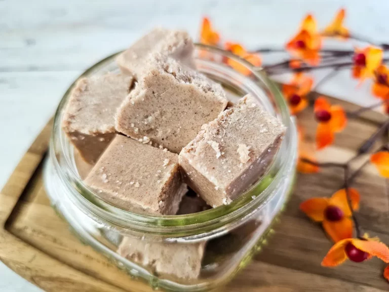 image of homemade pumpkin pie sugar scrub cubes in a glass jar