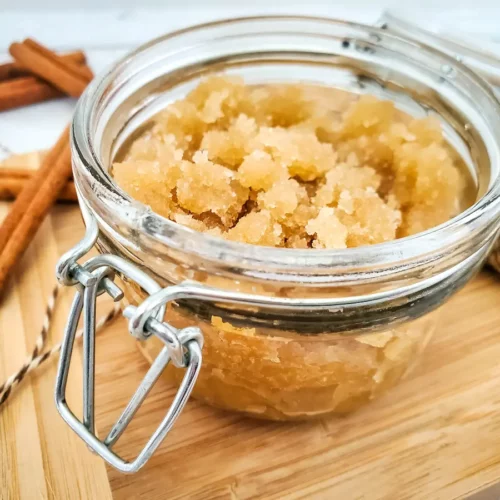 a jar of homemade apple cinnamon sugar scrub for fall