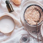 photo of bowl, oats, essential oil and lavender for a milk bath