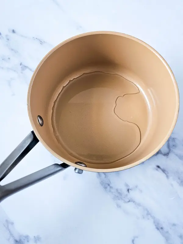 pot of water to boil for making homemade magnesium lotion