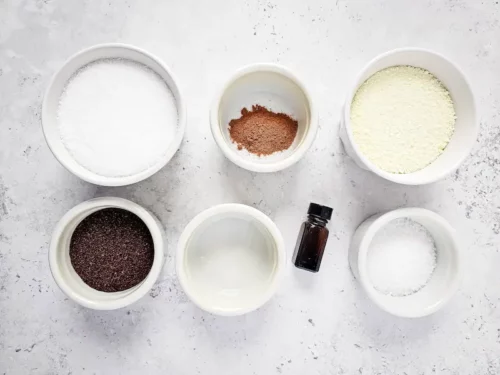 Pumpkin Latte Bath Salts DIY Recipe 13 bowls of salts, essential oils and other ingredients needed to make homemade pumpkin latte bath salts