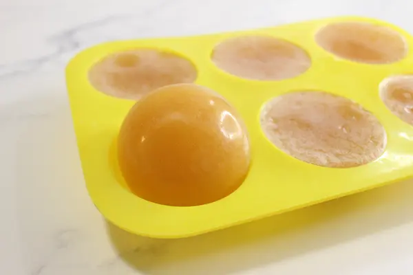 sea moss soap in mold with one soap popped out