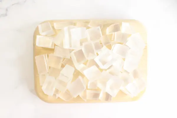 glycerin melt and pour soap base cut into squares on a cutting board