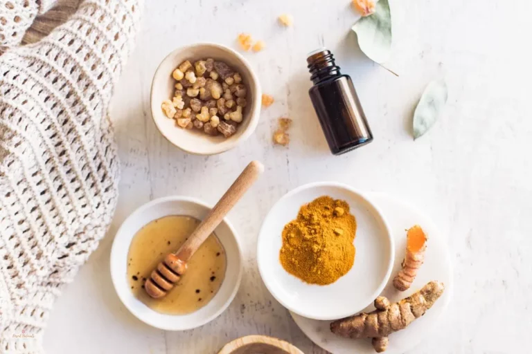 a group of bowls with turmeric, honey, and essential oil to make a turmeric face mask