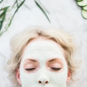woman using a homemade aloe vera match green tea face mask
