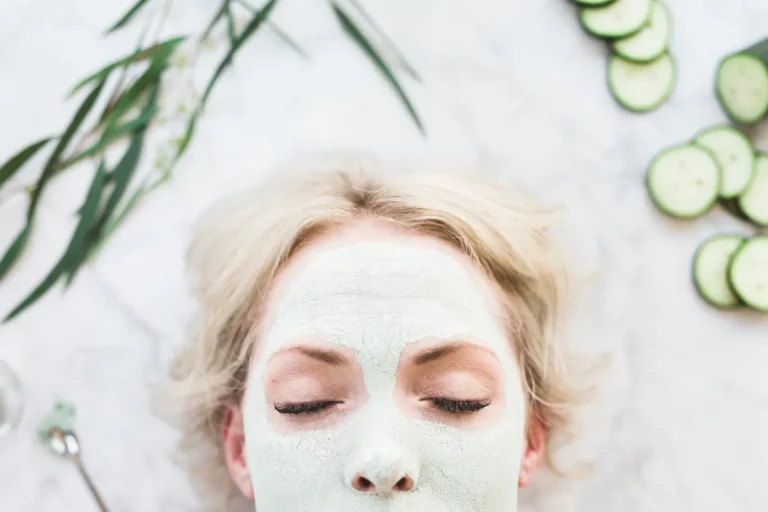 woman using a homemade aloe vera match green tea face mask