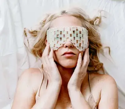 8 Homemade Face Mask DIY Recipes with natural ingredients for your skin care routine 13 woman using a jade eye mask