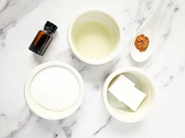 bowls of ingredients needed to make pumpkin pie sugar scrub cubes
