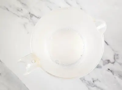 goat's milk melt and pour soap base in a measuring cup