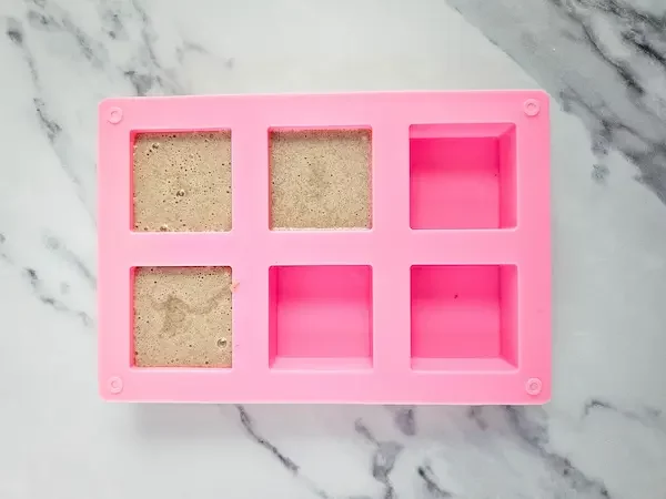 soap mold filled with sugar scrub cube mixture