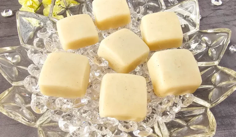 homemade vanilla bean lotion bars on a crystal plate