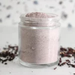 jar of homemade hibiscus cleansing scrub with dried hibiscus flowers