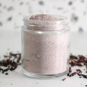 jar of homemade hibiscus cleansing scrub with dried hibiscus flowers