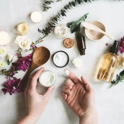jars of creams and bottles of oils for making natural skincare recipes
