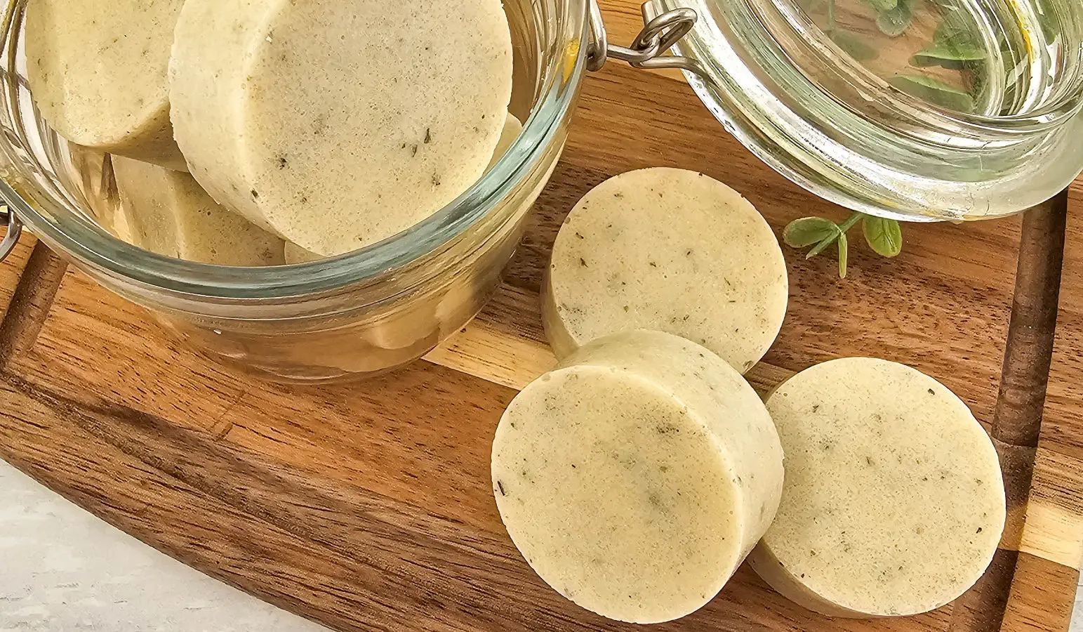 round homemade sugar scrub bars on a wooden cutting board