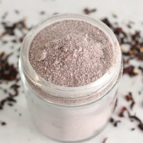 a jar of homemade hibiscus cleansing scrub