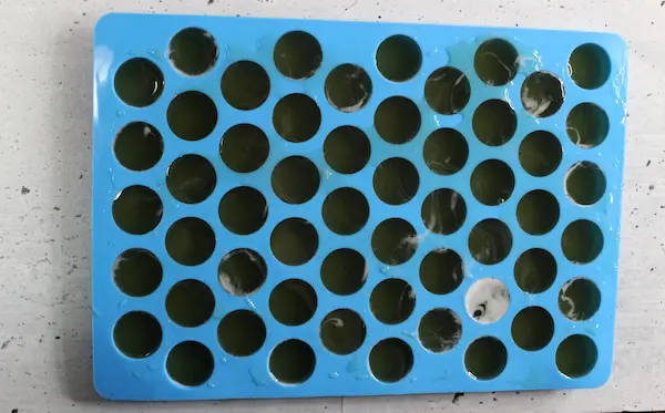 a silicone mold filled with sleep gummies mixture
