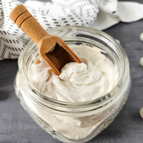 jar of homemade whipped gingerbread body butter on slate background