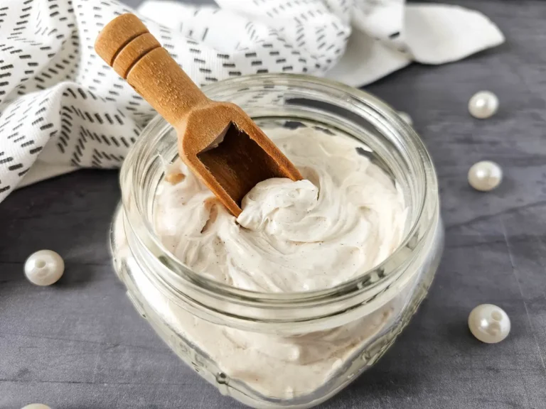 jar of homemade whipped gingerbread body butter on slate background
