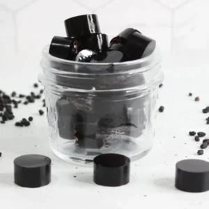 clear glass jar of homemade elderberry gummies