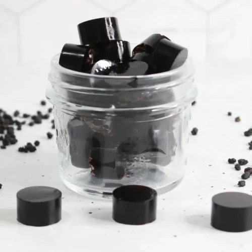 clear glass jar of homemade elderberry gummies